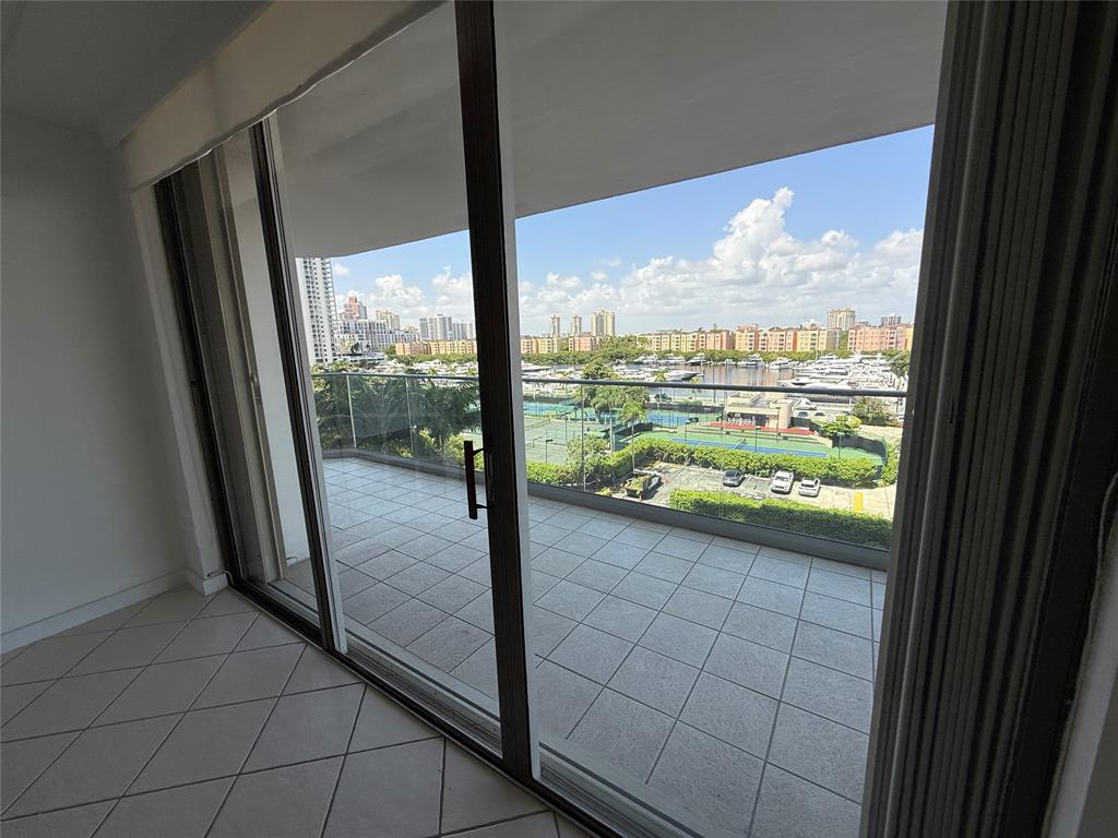 19707 Turnberry Way, Unit 7C Aventura, FL 33180 - Photo 11 of 40 a view of a large window with an outdoor view