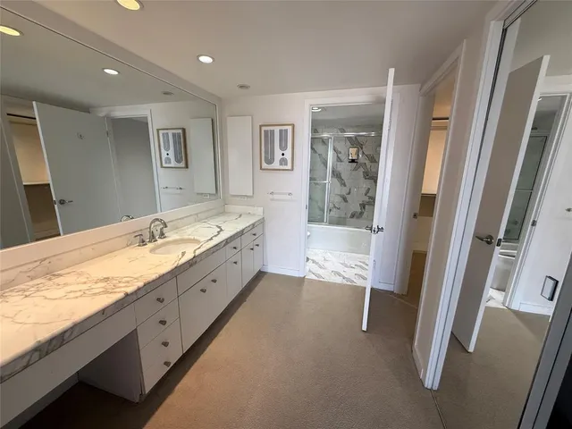 a bathroom with a shower and a toilet