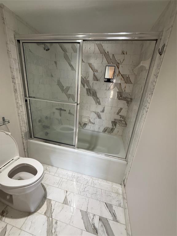 19707 Turnberry Way, Unit 7C Aventura, FL 33180 - Photo 16 of 40 a bathroom with a toilet and a shower