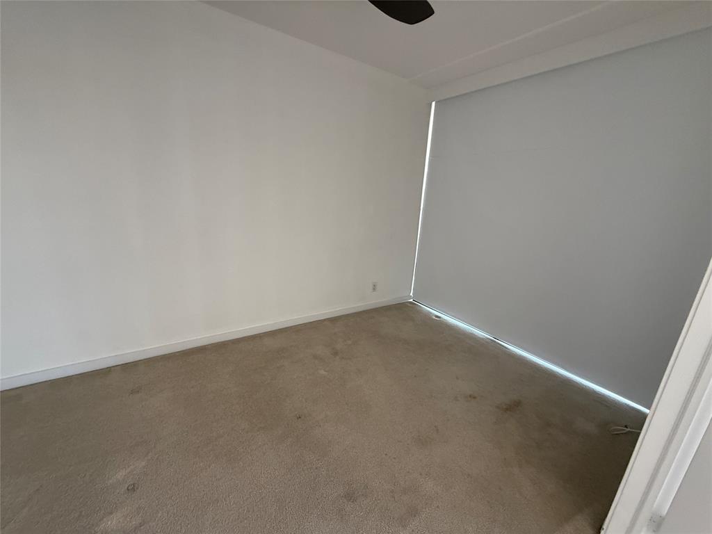 19707 Turnberry Way, Unit 7C Aventura, FL 33180 - Photo 18 of 40 an empty room with a workbench