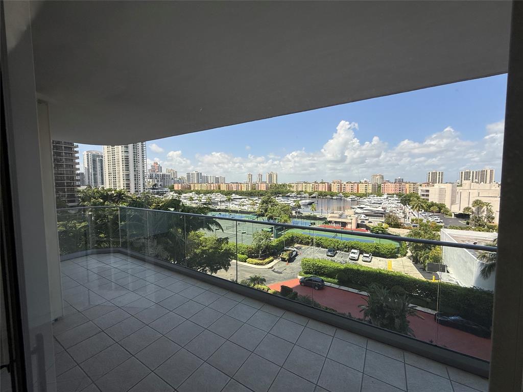 19707 Turnberry Way, Unit 7C Aventura, FL 33180 - Photo 22 of 40 a city view from a lake view