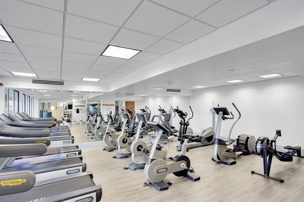 19707 Turnberry Way, Unit 7C Aventura, FL 33180 - Photo 26 of 40 a view of a room with gym equipment