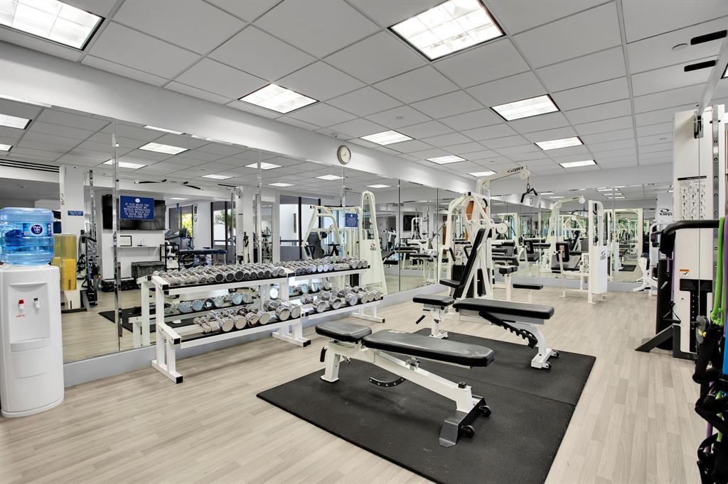 19707 Turnberry Way, Unit 7C Aventura, FL 33180 - Photo 27 of 40 a view of a room with gym equipment