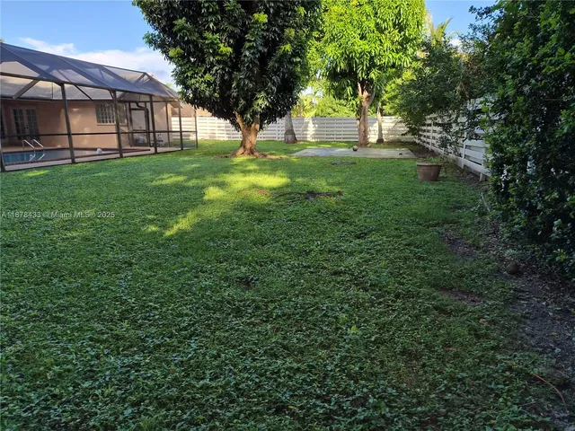 a kitchen with stainless steel appliances a refrigerator and a stove top oven