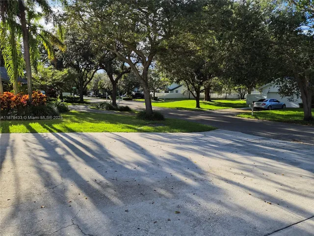 a view of swimming pool with trees in the background