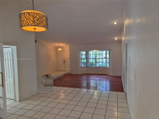 a view of an empty room and window