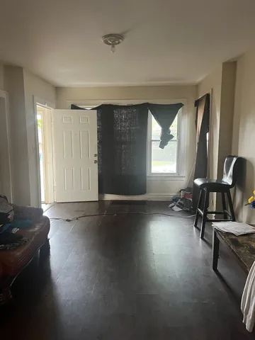 a view of a room with gym equipment and a window