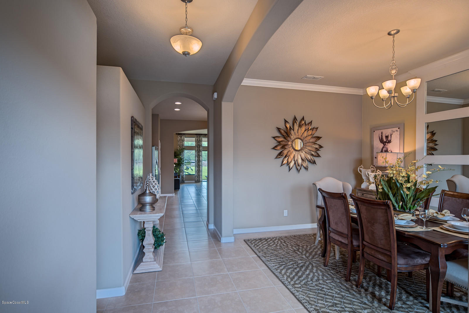 4052 Ruthann Circle Melbourne, FL 32934 - Photo 3 of 12 a view of a dining room with furniture and chandelier