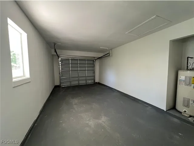a view of a room with window and brick walls