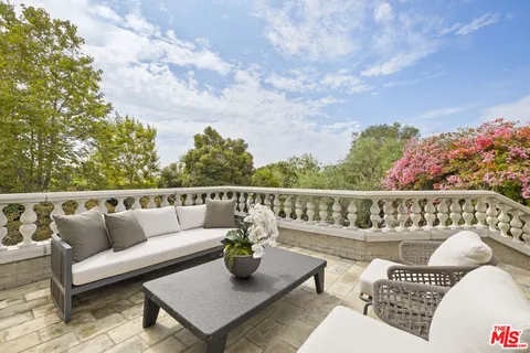 swimming pool view with a seating space