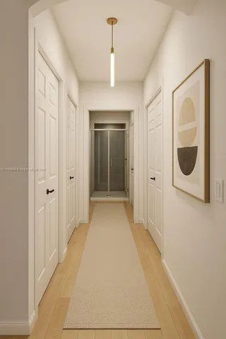 a view of a room with wooden floor and windows