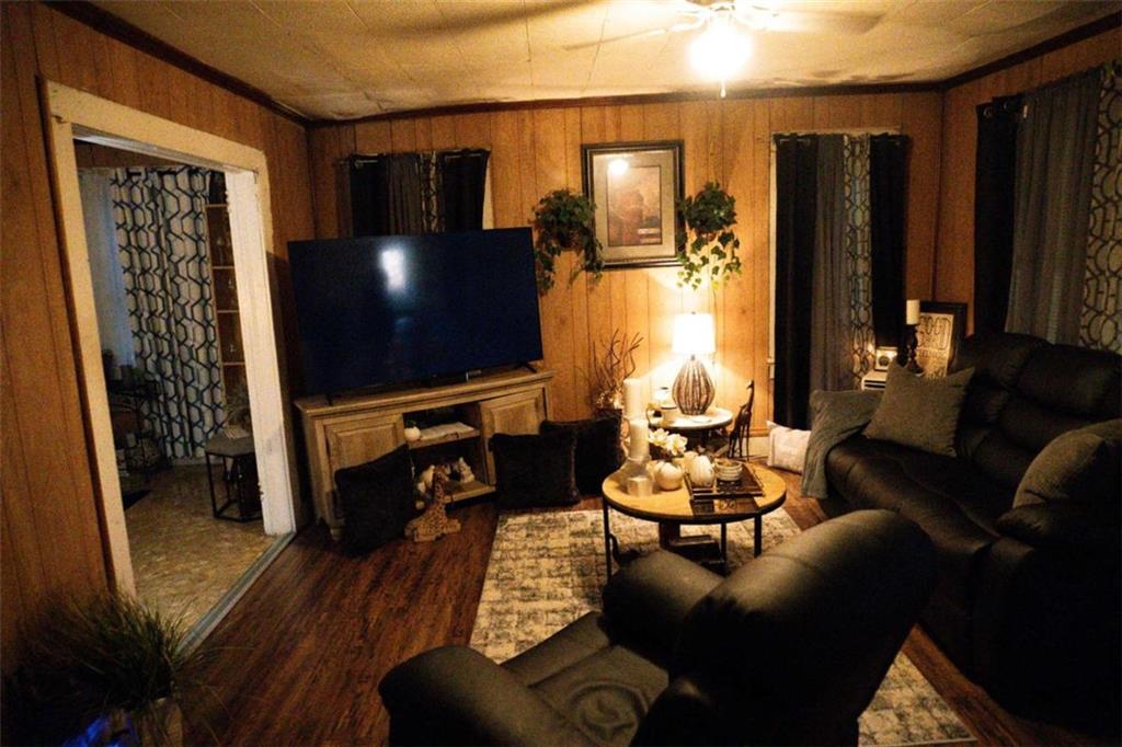 525 East 14th Street Rome, GA 30161 - Photo 5 of 12 a living room with furniture and a flat screen tv