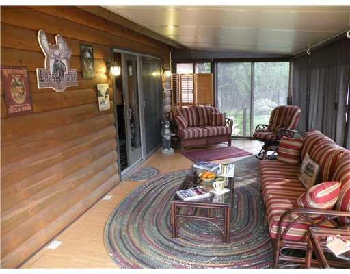 91 Ostrom Road Bowerbank, ME 04426 - Photo 14 of 25 Patio/Deck. Screened-in porch