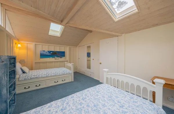 a bedroom with furniture and a window