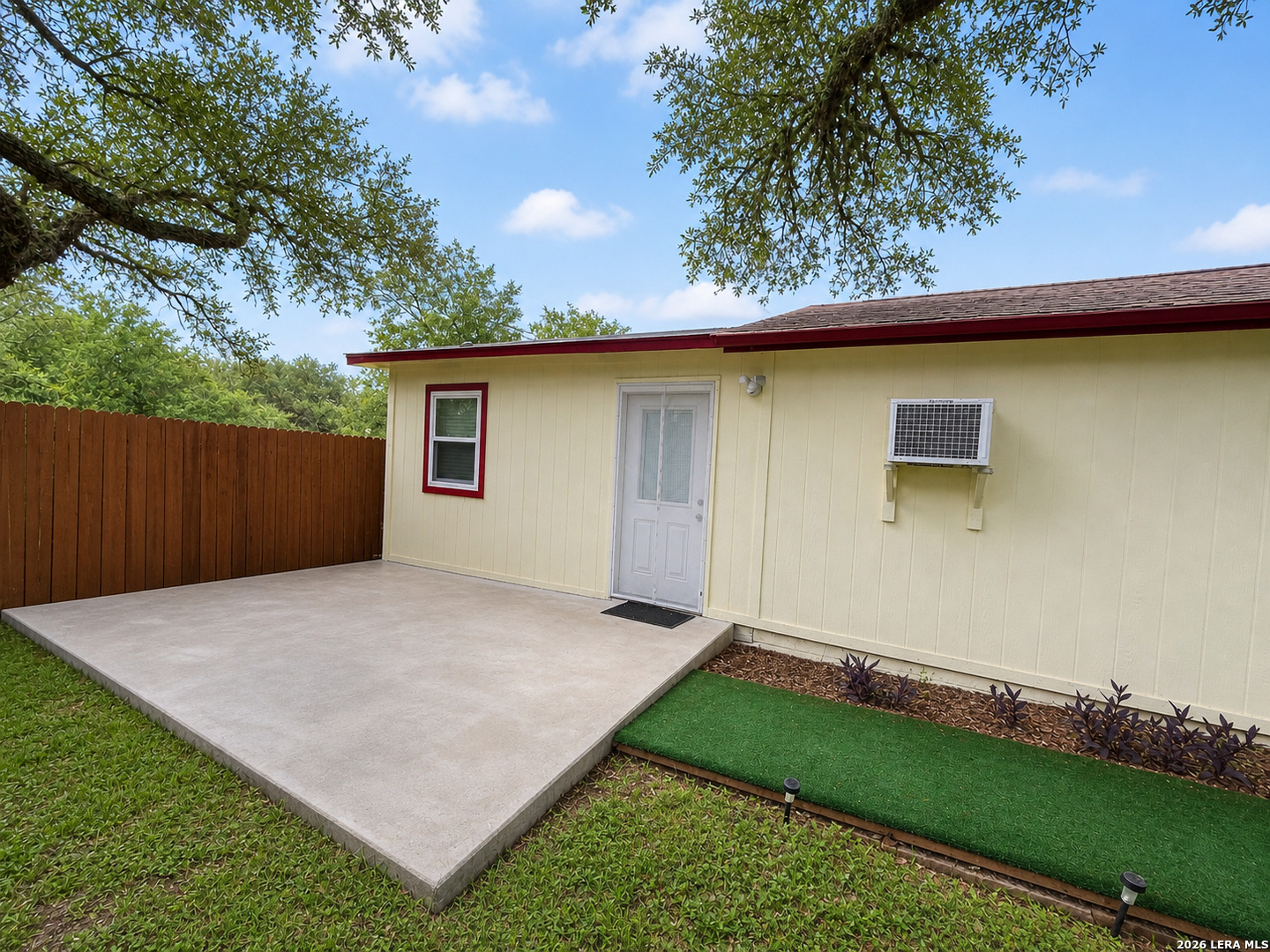 118 Stonegate South, Unit 2 Boerne, TX 78006 - Photo 1 of 7 a backyard of a house with lots of green space