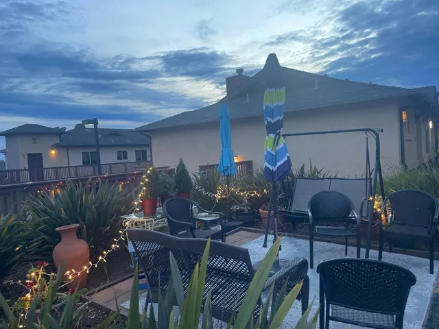 a living room filled with furniture and flowers