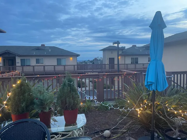 a view of a chairs and table in the patio