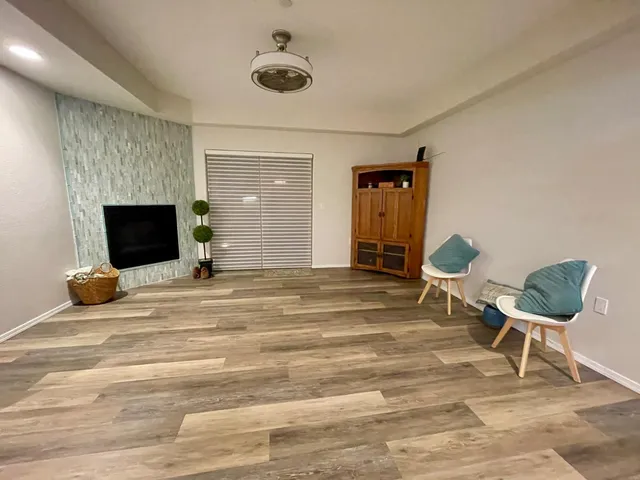 a bedroom with a bed and a chair