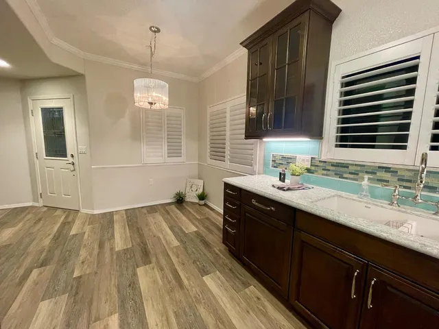 a bathroom with a sink a vanity and a mirror