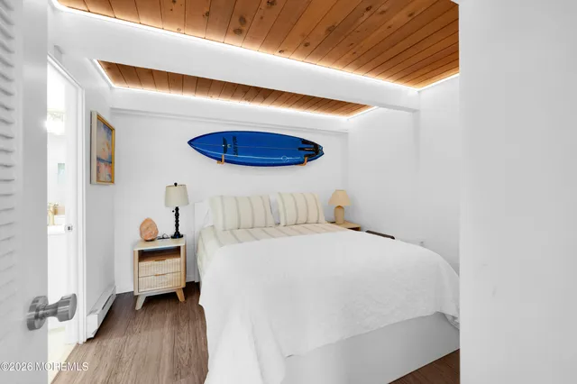 a bedroom with a bed and a cabinets