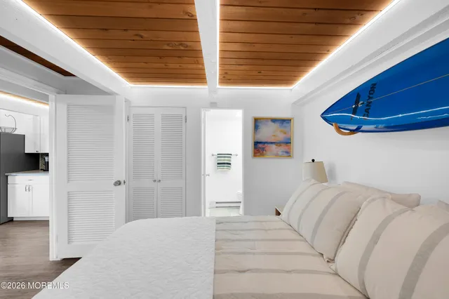 a bed room with a bed and a large window