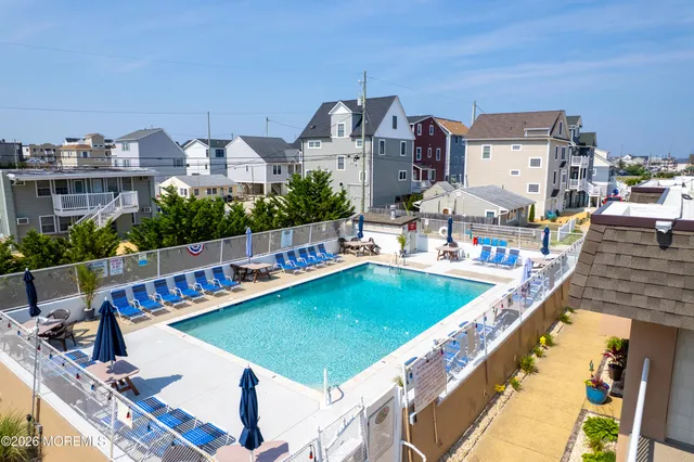 a view of a swimming pool with a lounge chairs