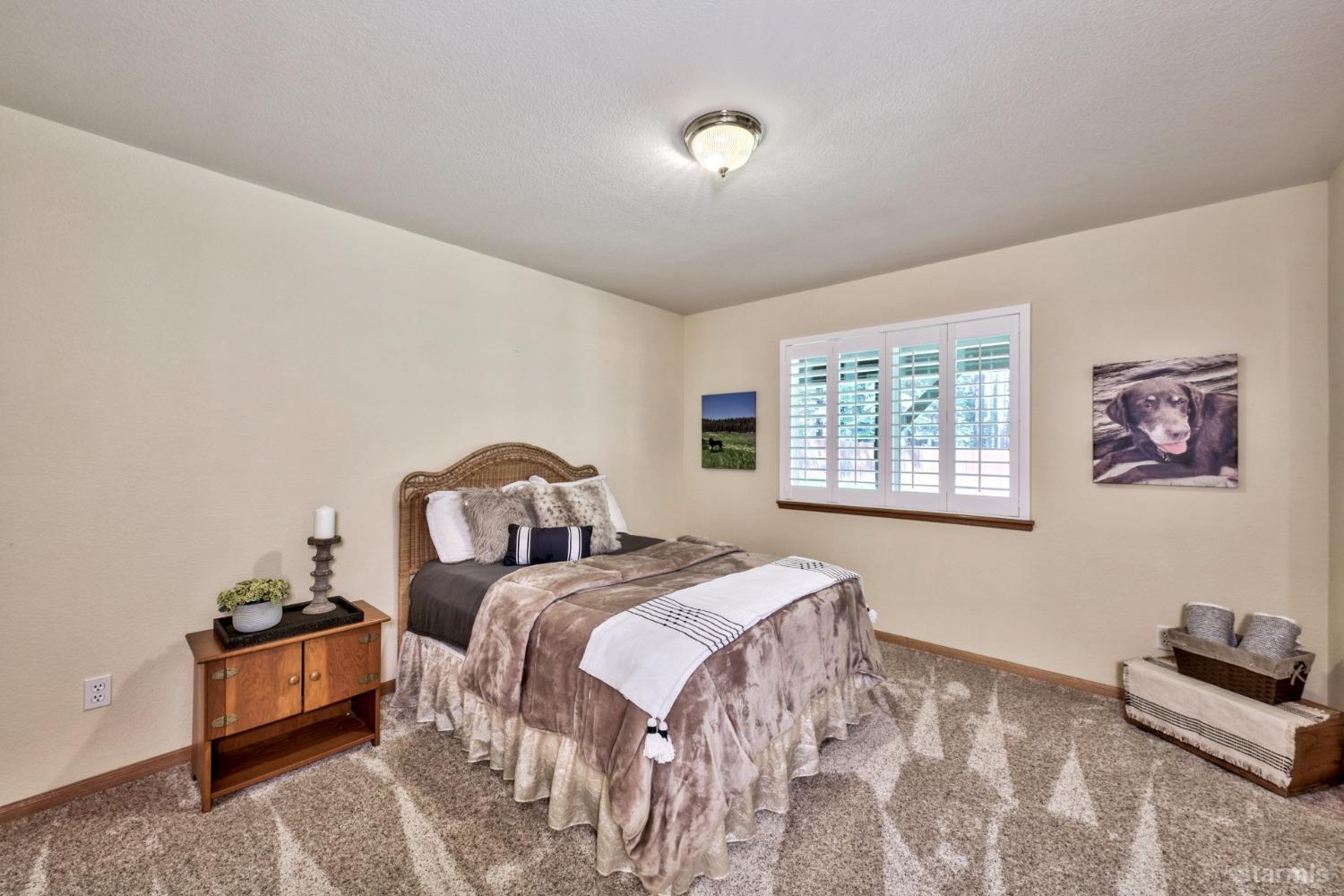 1569 Aztec Way South Lake Tahoe, CA 96150 - Photo 20 of 22 a bedroom with double bed and a large window