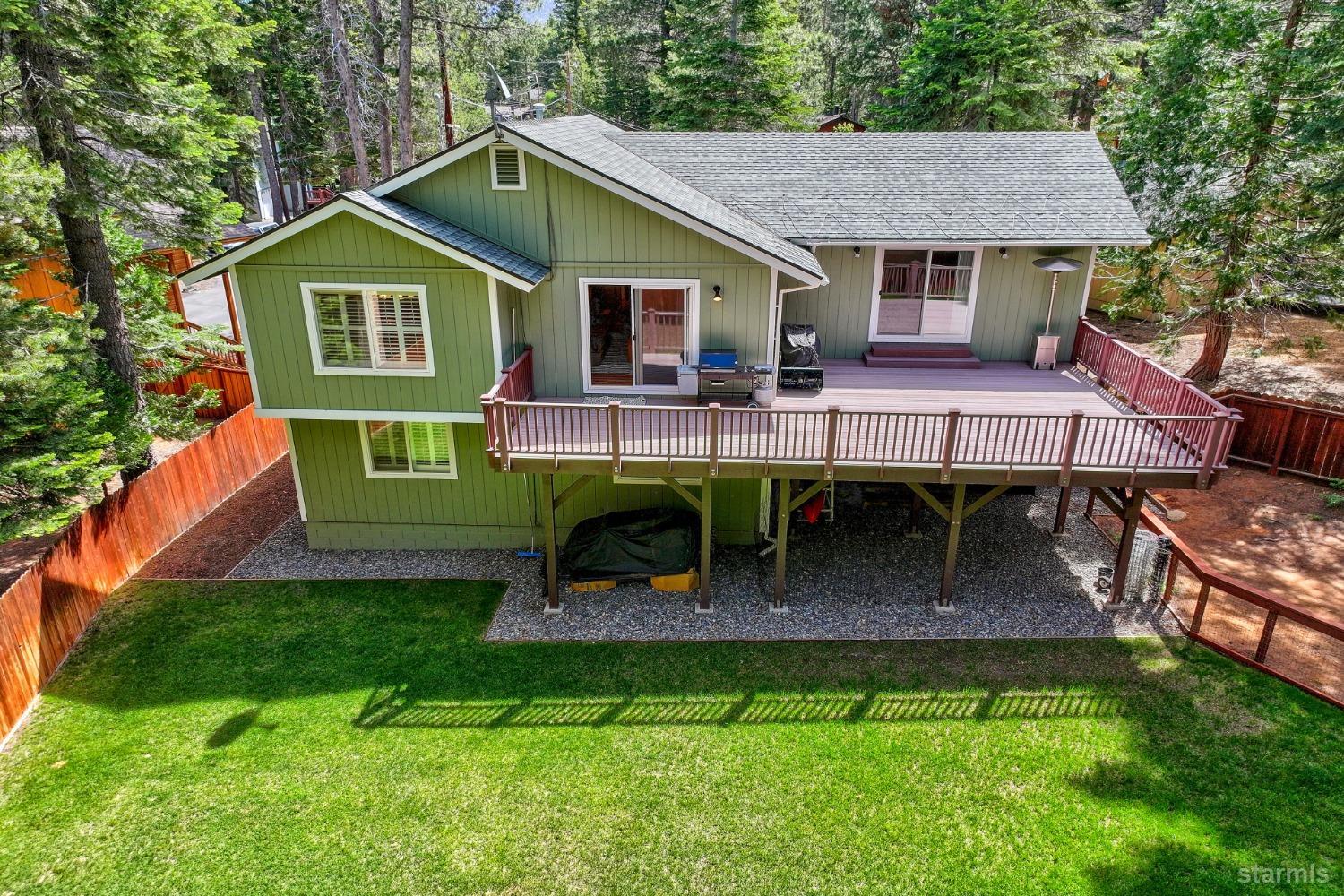 1569 Aztec Way South Lake Tahoe, CA 96150 - Photo 2 of 22 a front view of a house with garden