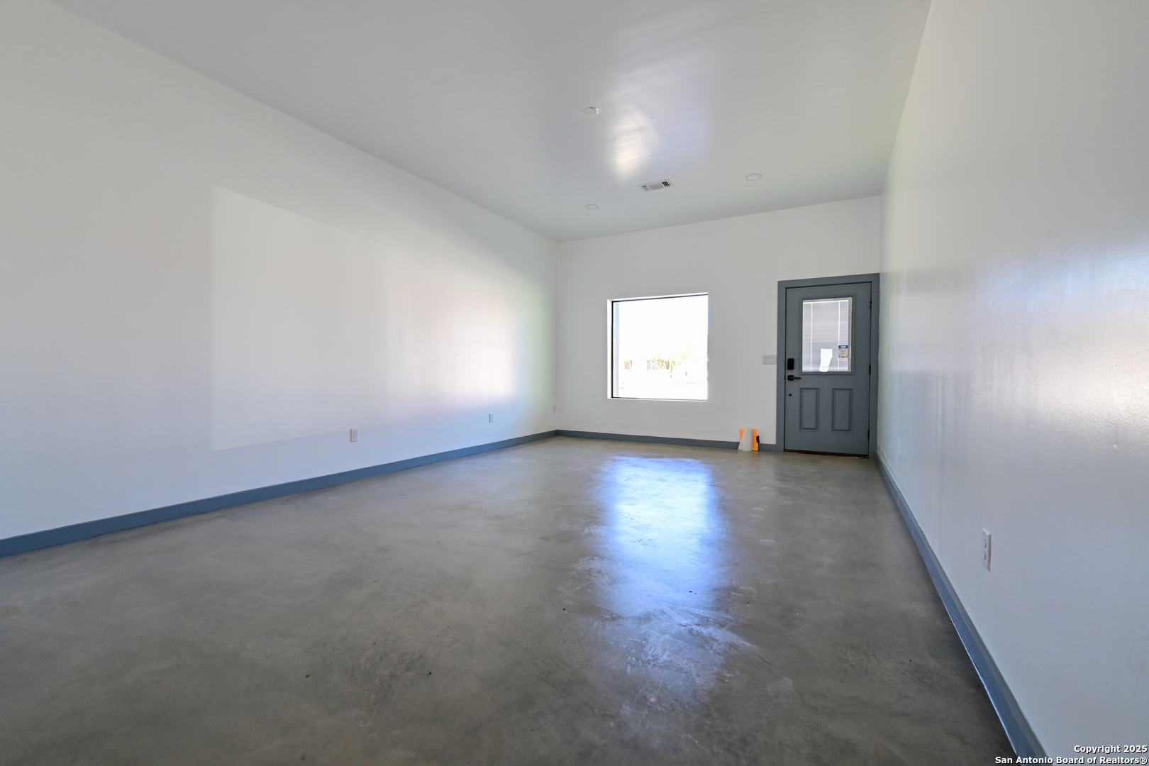 1003 West Galveston Street Marfa, TX 79843 - Photo 11 of 23 an empty room with windows