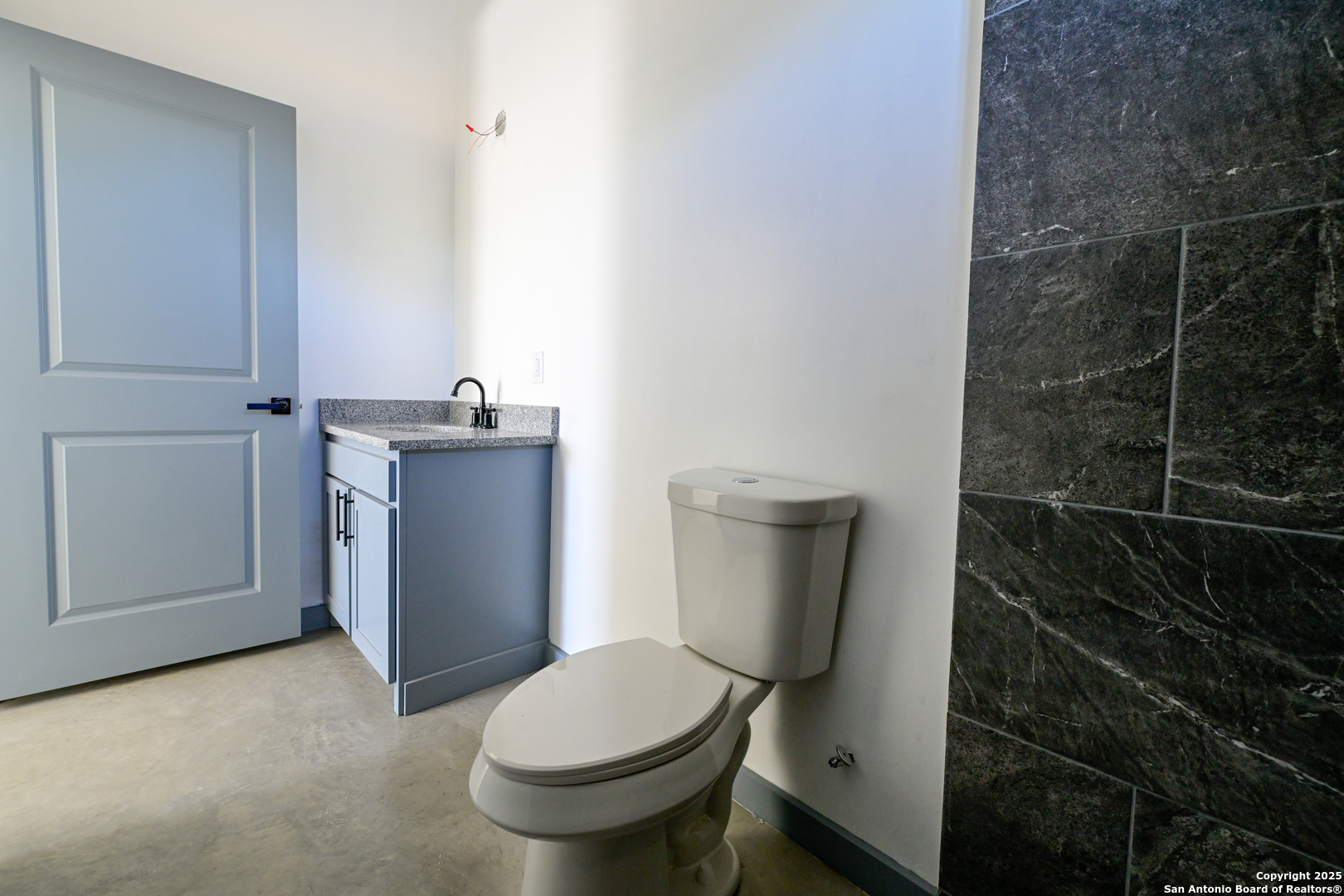 1003 West Galveston Street Marfa, TX 79843 - Photo 17 of 23 a bathroom with a toilet and a shower