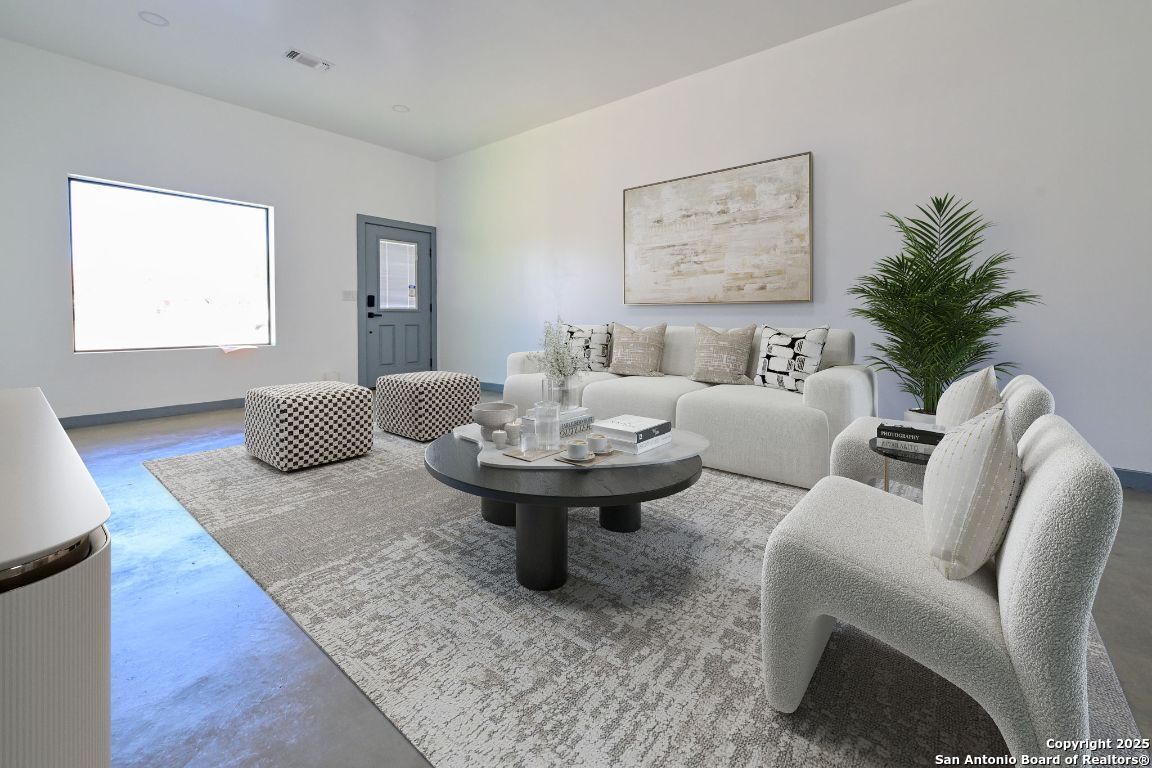 1003 West Galveston Street Marfa, TX 79843 - Photo 2 of 23 a living room with furniture and a table