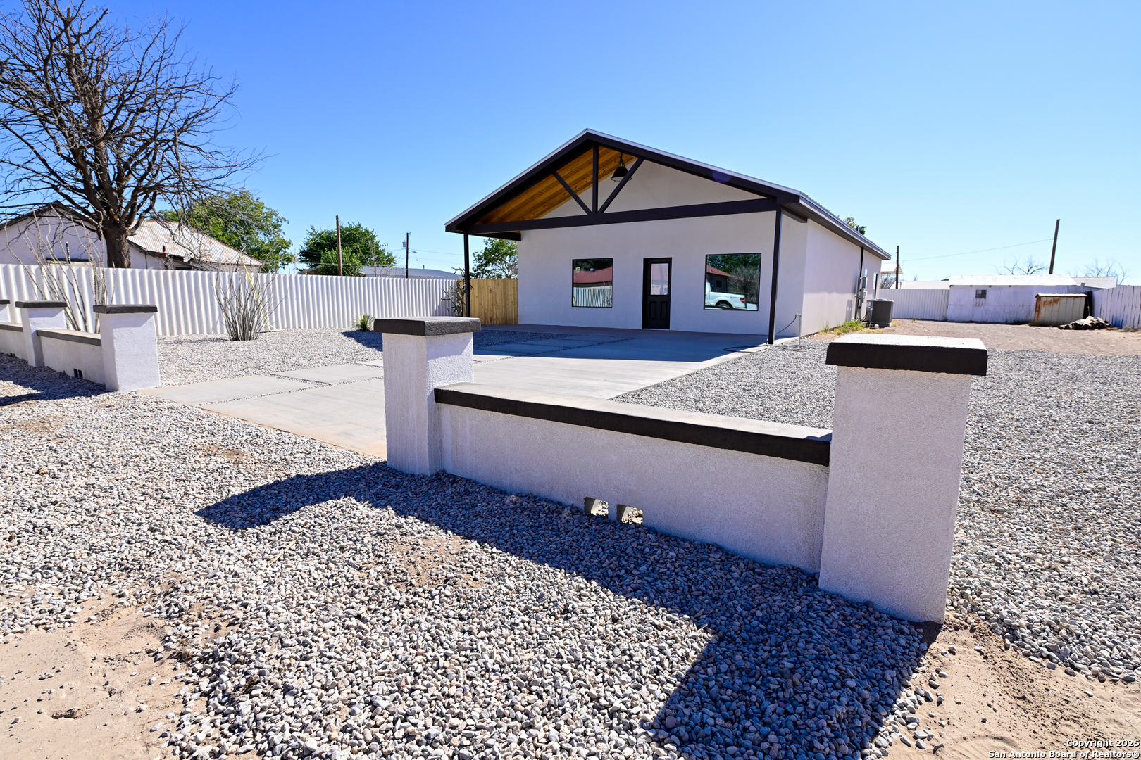 1003 West Galveston Street Marfa, TX 79843 - Photo 4 of 23 a front view of a house with a yard