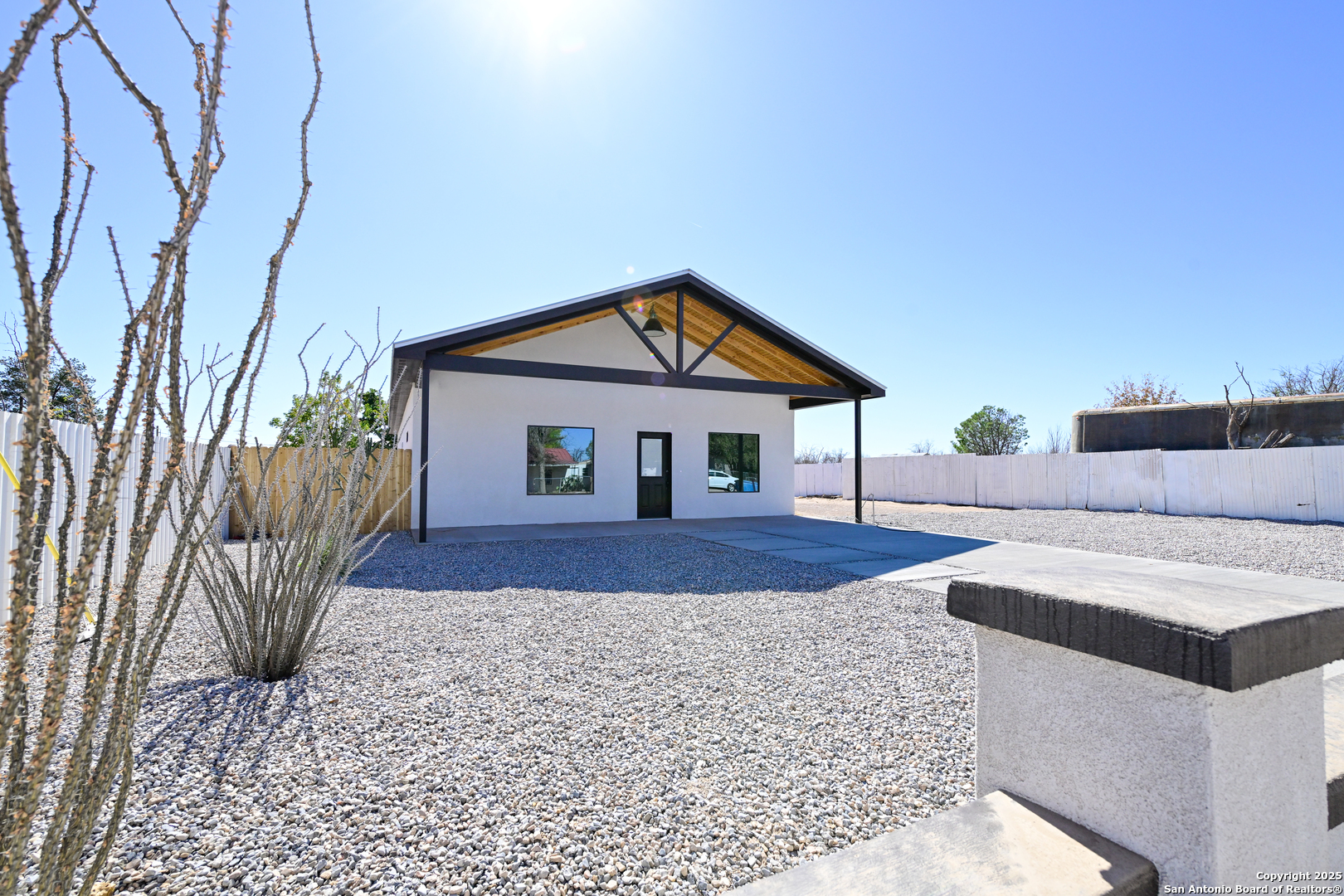 1003 West Galveston Street Marfa, TX 79843 - Photo 8 of 23 a front view of a house with garden