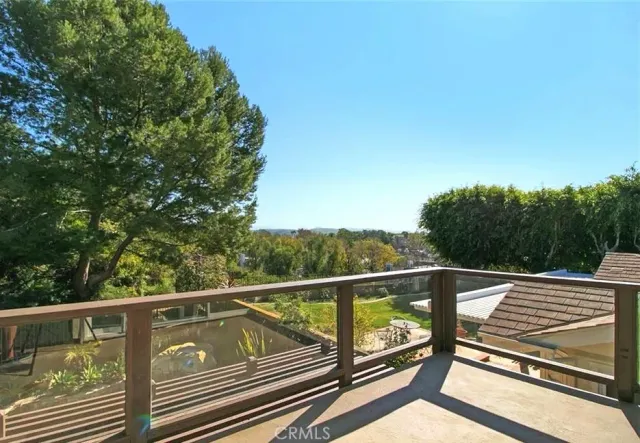 a view of a two chairs and table in the balcony