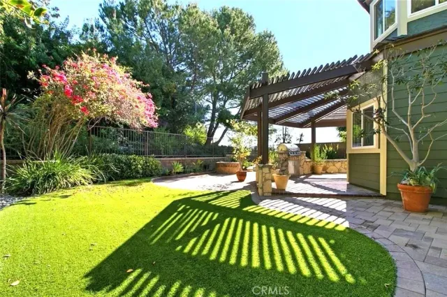a view of swimming pool with a patio