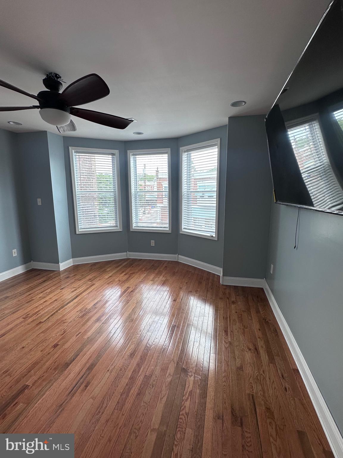 5254 Jefferson Street Philadelphia, PA 19131 - Photo 28 of 30 an empty room with wooden floor and windows