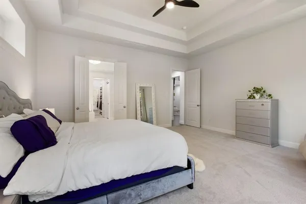 a bedroom with a bed and a cabinets