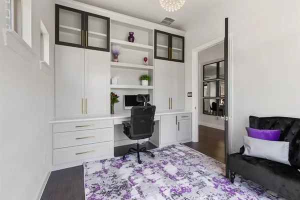 a living room with furniture and a rug
