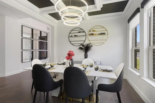 a dining room with furniture and window