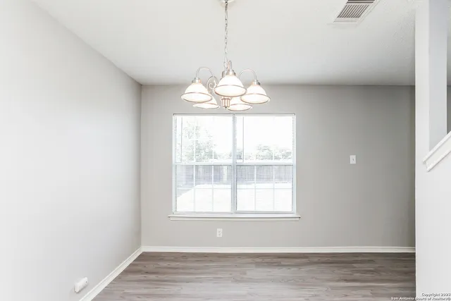 a window in a room with wooden floor