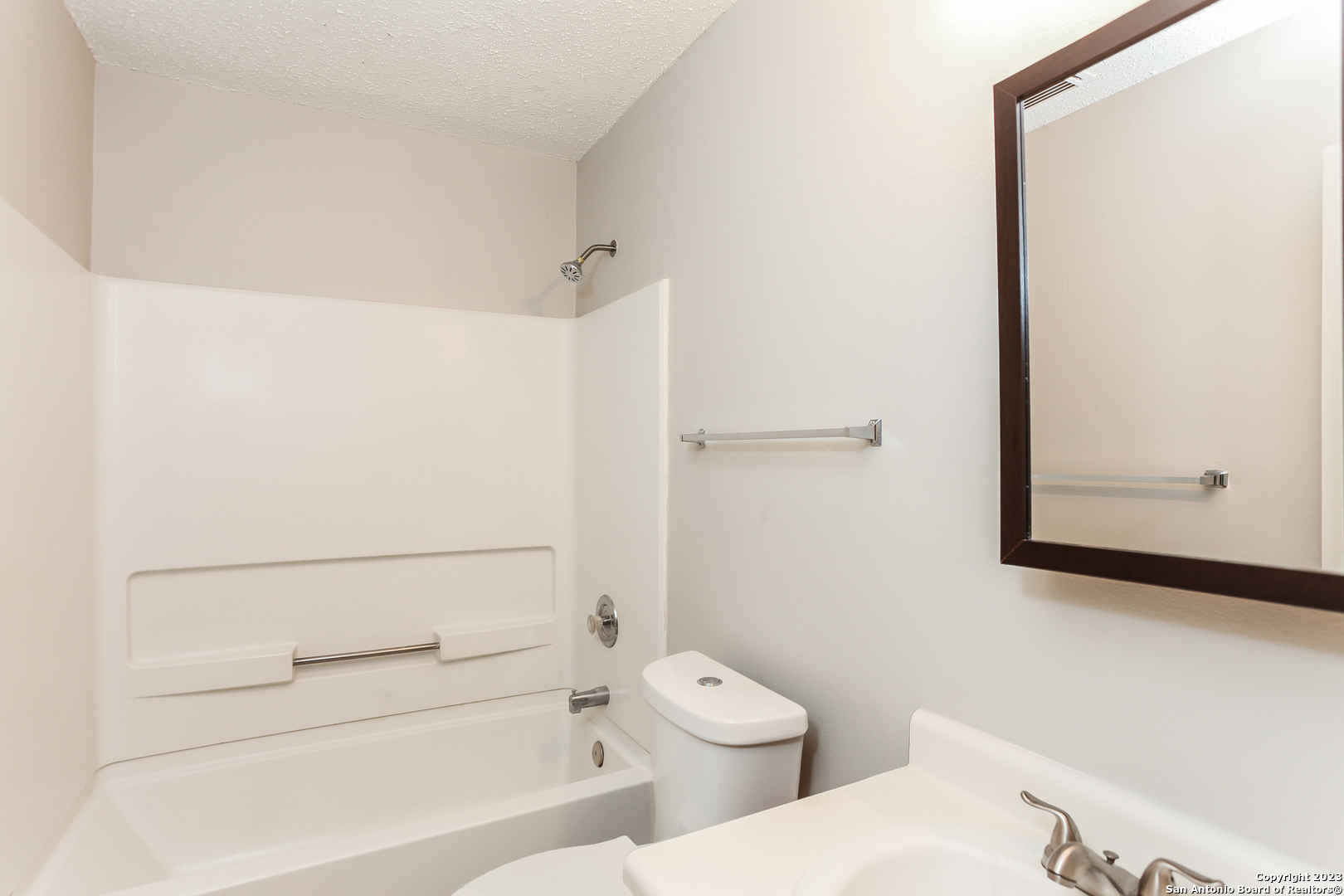 6135 Lyndell Spring San Antonio, TX 78244 - Photo 9 of 17 a bathroom with a toilet and a shower