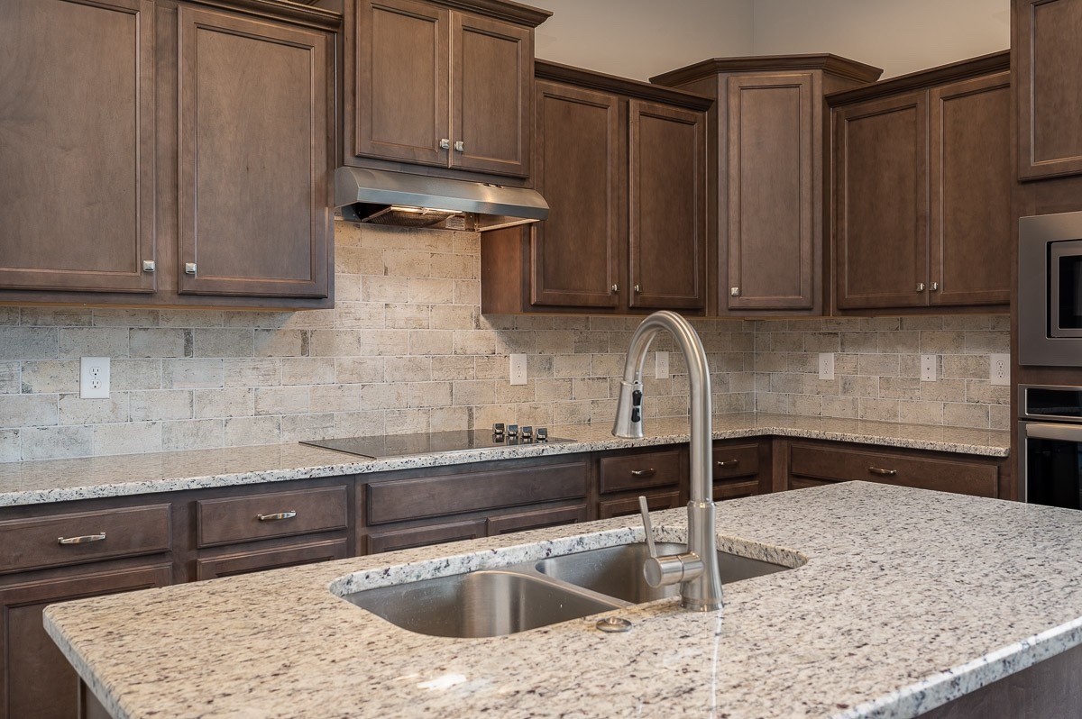 958 Hunters Lane Springfield, TN 37172 - Photo 9 of 11 a kitchen with stainless steel appliances granite countertop a sink stove and refrigerator