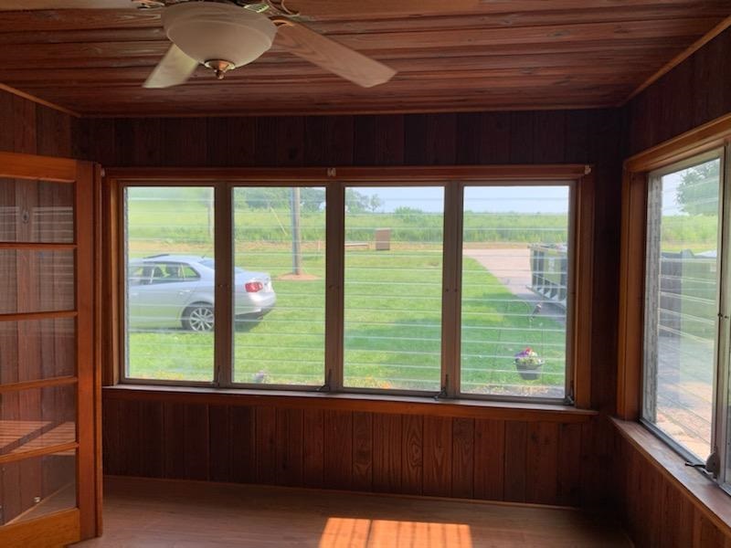 7504 North River Road Byron, IL 61010 - Photo 39 of 46 a front view of a room with large windows