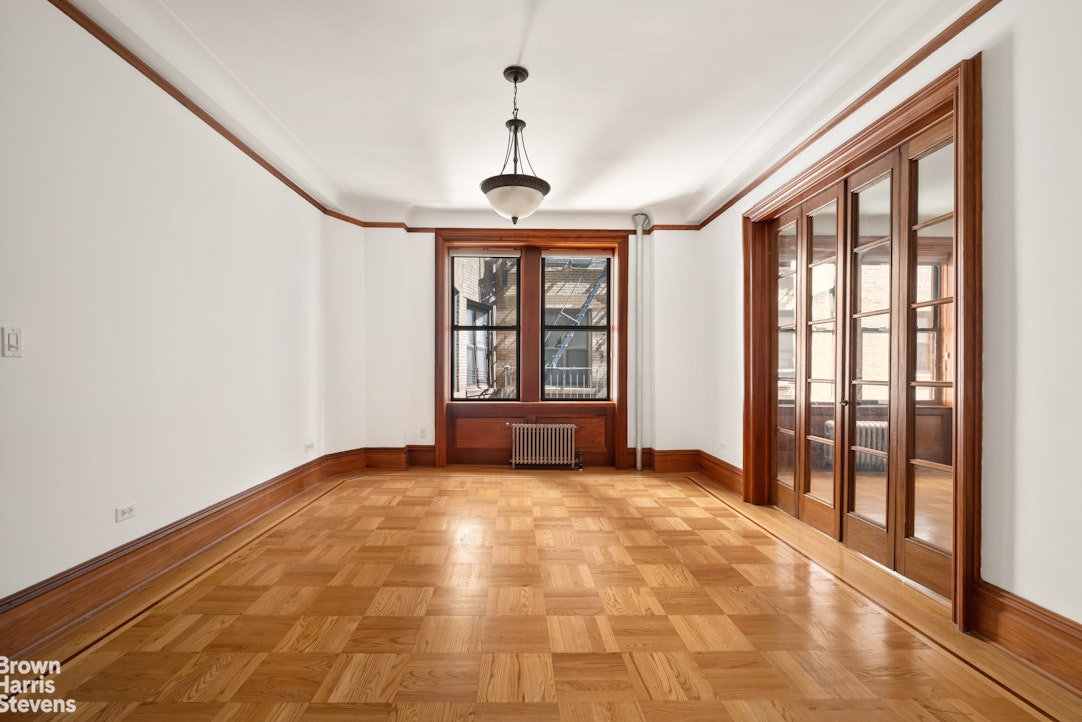 790 Riverside Drive, Unit 4J Manhattan, NY 10032 - Photo 7 of 11 a view of an empty room with glass door