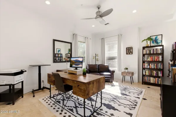 a workspace with furniture and bookshelf