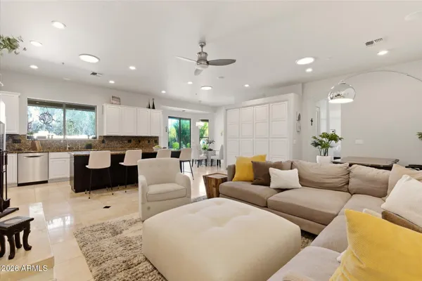 a living room with furniture and a large window