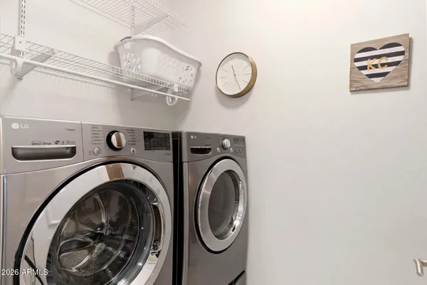 a view of livingroom with washer and dryer