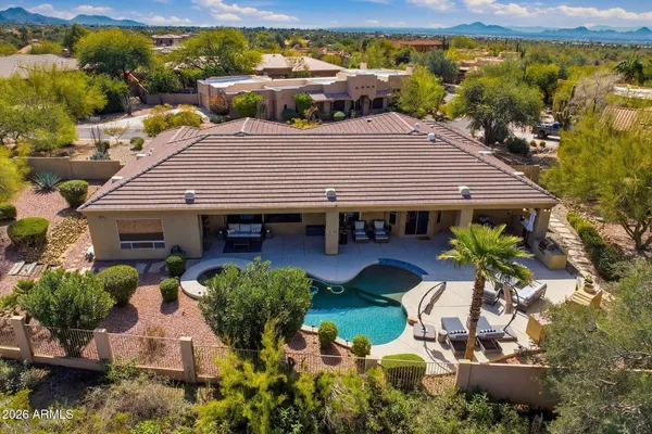 a aerial view of a house with table and chairs in patio