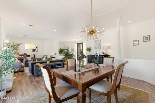 a view of a dining room with furniture window and wooden floor