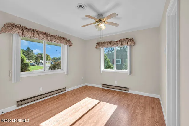 a view of entryway with wooden floor